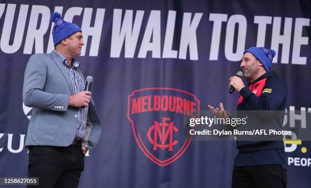 David Neitz and Russell Robertson address Walk to the 'G participants at Federation Square before the 2023 AFL Round 13 match between the Melbourne...