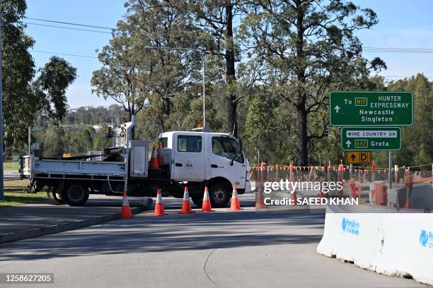 Truck blocks a road some 500 meters from the site of a bus crash, where 10 people from a wedding party were killed, in Cessnock, in Australia's...