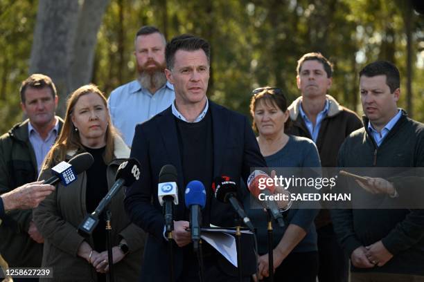 New South Wales premier Christopher John Minns talks to the press on a road some 500 meters from the site of a bus crash, where 10 people from a...