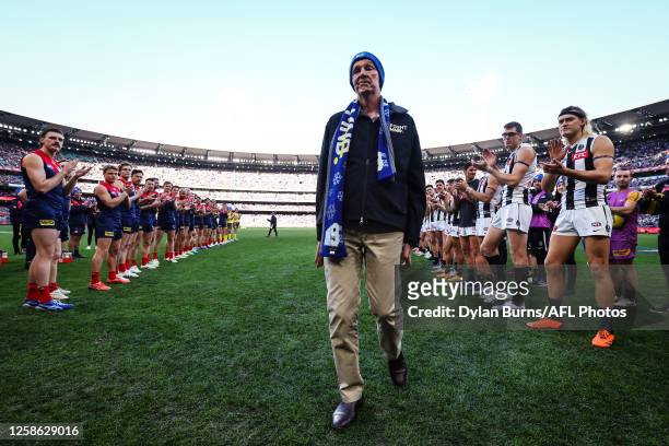 Guard of honour is formed for Neale Daniher during the 2023 AFL Round 13 match between the Melbourne Demons and the Collingwood Magpies at the...