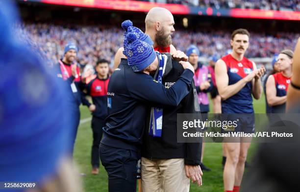 Neale Daniher is hugged by Simon Goodwin, Senior Coach of the Demons during the 2023 AFL Round 13 match between the Melbourne Demons and the...