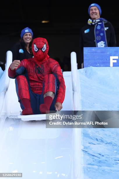 Former Hawthorn Champion Shaun Burgoyne is seen on the Big Freeze slide during the 2023 AFL Round 13 match between the Melbourne Demons and the...