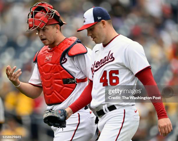 Washington Nationals catcher Riley Adams , left, walks to the dugout with Washington Nationals starting pitcher Patrick Corbin the during the...