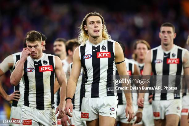 Darcy Moore of the Magpies looks dejected after a loss during the 2023 AFL Round 13 match between the Melbourne Demons and the Collingwood Magpies at...