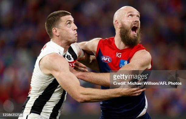 Max Gawn of the Demons and Darcy Cameron of the Magpies compete in a ruck contest during the 2023 AFL Round 13 match between the Melbourne Demons and...