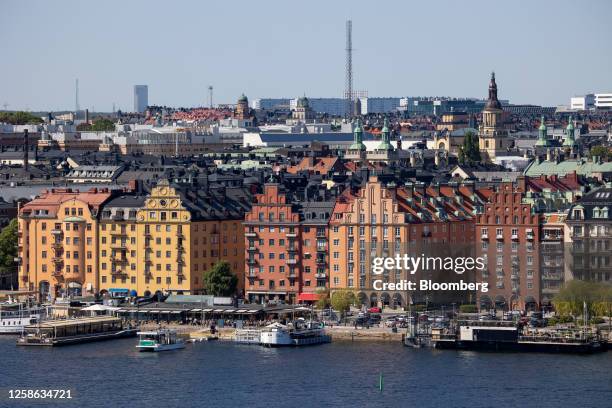 Buildings on the skyline by the harbour in Stockholm, Sweden, on Sunday, June 11, 2023. Swedish households are becoming more optimistic about the...