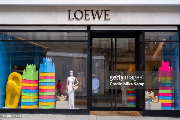 Loewe shop window containing large scale plastic sand castle buckets on Bond Street on 22nd May 2023 in London, United Kingdom. Bond Street is one of...