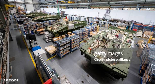 June 2023, Lower Saxony, Unterlüß: Lynx infantry fighting vehicles stand in a Rheinmetall production hall. Photo: Philipp Schulze/dpa