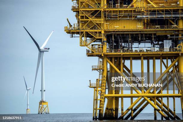 Photograph taken on June 8, 2023 shows wind turbines at the Seagreen Offshore Wind Farm, under construction around 27km from the coast of Montrose,...
