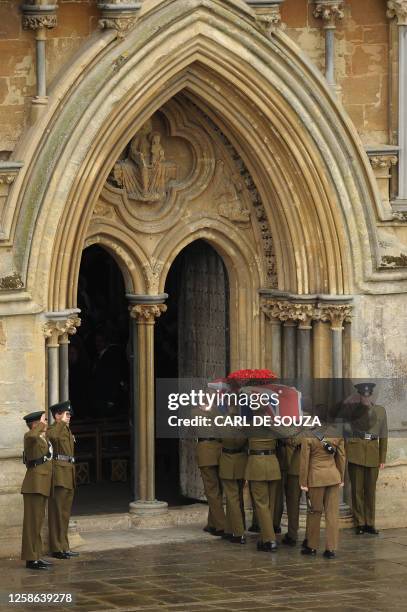 Coffin bearing the body of Harry Patch, the last soldier to fight in the trenches of Europe in World War I, is carried into Wells Cathedral in...