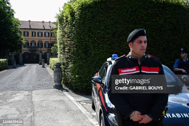 An Italian carabineri stands guard outside Villa San Martino, the residence of Italian businessman and former prime minister Silvio Berlusconi,...