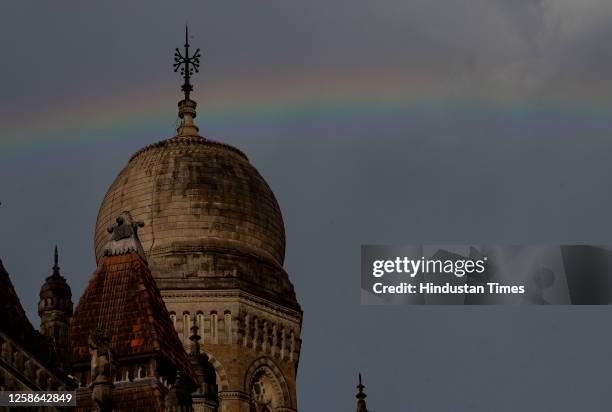 Rainbow sprawls across the sky, after sudden shower of rain at Chhatrapati Shivaji Maharaj Terminus, on June 11, 2023 in Mumbai, India.