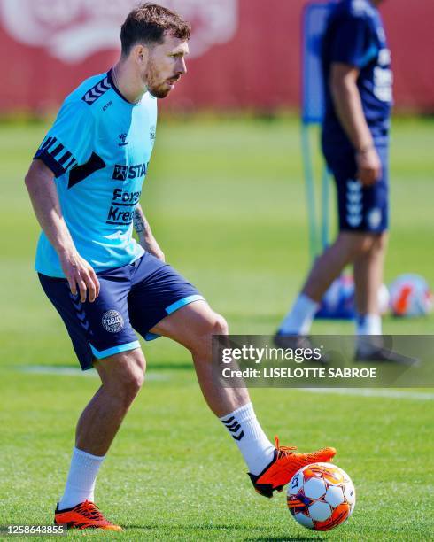 Denmark's Pierre-Emile Hoejbjerg plays the ball during the Danish national football team's training session ahead of the UEFA Euro 2024 qualifiers in...