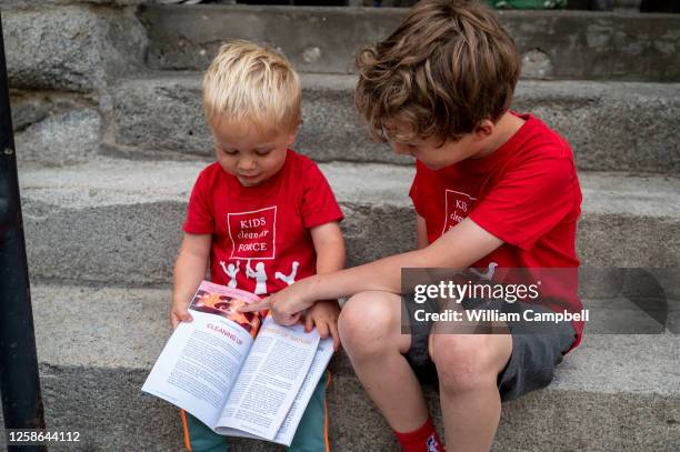 Mario Zanoni and Soren Ensing outside the court house for the nation's first youth climate change trial at Montana's First Judicial District Court on...