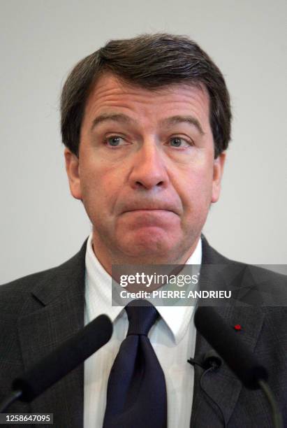 French Education minister Xavier Darcos reads a copy of the farewell letter written by executed French young Communist Resistance fighter Guy Moquet...