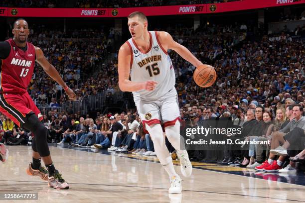 Nikola Jokic of the Denver Nuggets dribbles the ball during Game Five of the 2023 NBA Finals against the Miami Heat on June 12, 2023 at Ball Arena in...