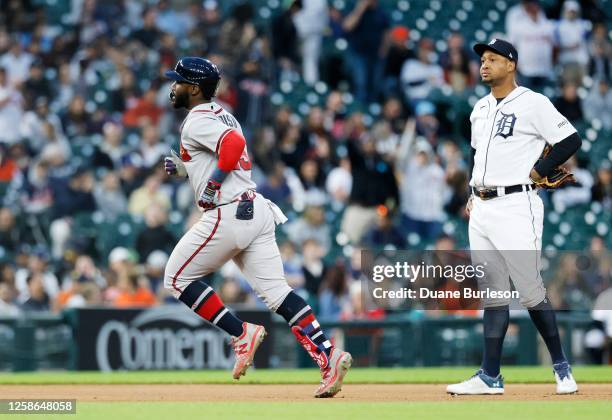 Michael Harris II of the Atlanta Braves rounds the bases past third baseman Jonathan Schoop of the Detroit Tigers after hitting a home run in the...