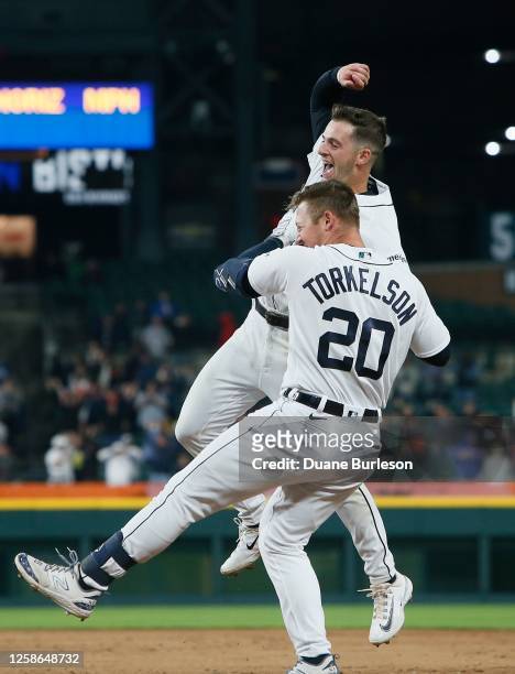 Spencer Torkelson of the Detroit Tigers celebrates his walk-off single with Zack Short for a 6-5 win over the Atlanta Braves in the 10th inning at...