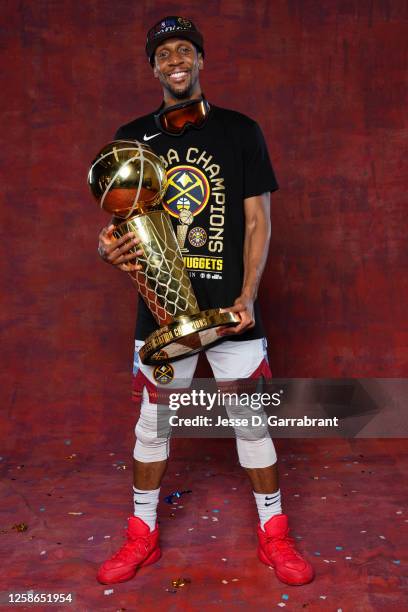 Ish Smith of the Denver Nuggets poses for a portrait with the Larry O'Brien Trophy after winning Game Five of the 2023 NBA Finals on June 12, 2023 at...
