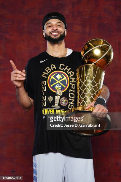 Jamal Murray of the Denver Nuggets poses for a portrait with the Larry O'Brien Trophy after winning Game Five of the 2023 NBA Finals on June 12, 2023...