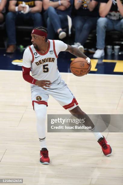 Kentavious Caldwell-Pope of the Denver Nuggets dribbles the ball during game 5 of the 2023 NBA Finals against the Miami Heat on June 12, 2023 at the...