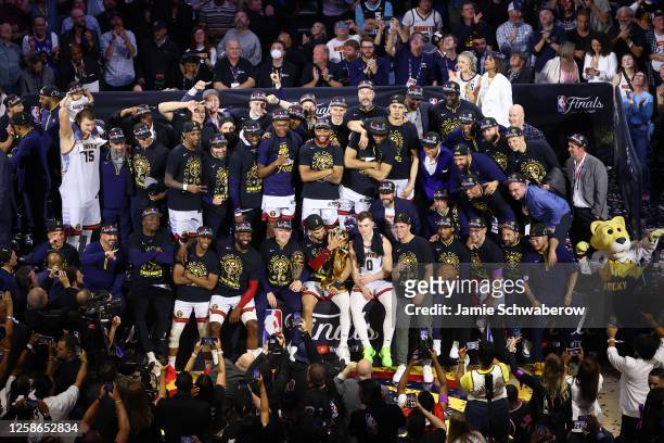 The Denver Nuggets celebrate with the Larry O'Brien Championship Trophy after game 5 of the 2023 NBA Finals against the Miami Heat on June 12, 2023...