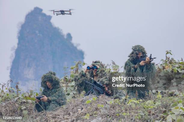 Special warfare reconnaissance team members conduct a field reconnaissance training in Hechi City, Guangxi Province, China, Feb. 17, 2023.