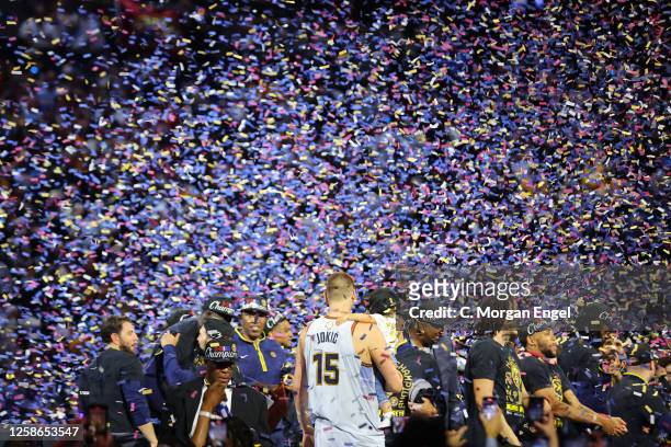 Nikola Jokic of the Denver Nuggets celebrates with daughter Ognjena after winning Game Five of the 2023 NBA Finals against the Miami Heat on June 12,...