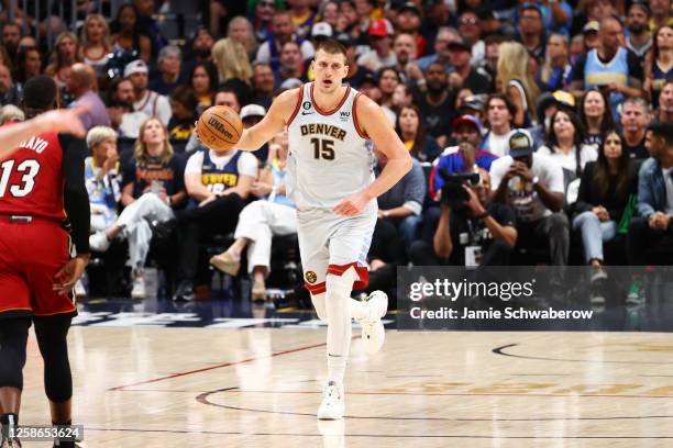Nikola Jokic of the Denver Nuggets dribbles the ball during game 5 of the 2023 NBA Finals against the Miami Heat on June 12, 2023 at the Ball Arena...