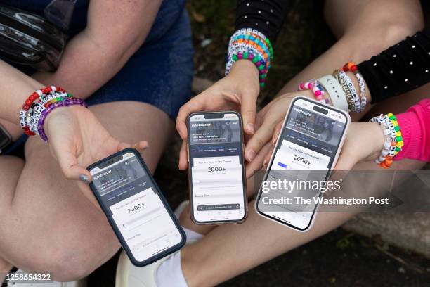 May 13: Anna Mason, Emily Lind, and Kristen Robinson show their Ticketmaster queue, which displays over 2000+ people ahead of them, from the parking...