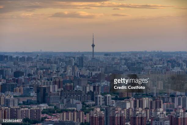 The Central television transmission tower stands out among urban buildings in Beijing, China, June 12, 2023.