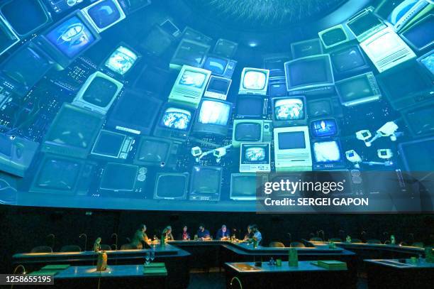 People enjoy the atmosphere as they visit the Alchemist restaurant in Copenhagen, Denmark, on May 25, 2023. With off-the-wall dishes like butterfly...