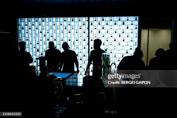 Chefs prepare food at the kitchen of the Alchemist restaurant in Copenhagen, Denmark, on May 25, 2023. With off-the-wall dishes like butterfly wings...