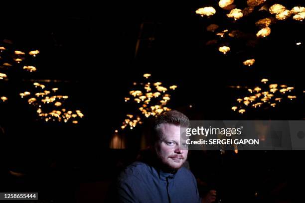 Chef Rasmus Munk poses for a photo during an interview with AFP at the Alchemist restaurant in Copenhagen, Denmark, on May 25, 2023. With...