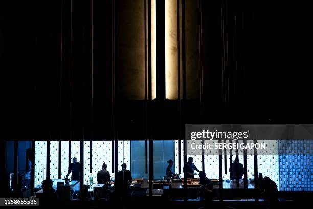 Chefs prepare food at the kitchen of the Alchemist restaurant in Copenhagen, Denmark, on May 25, 2023. With off-the-wall dishes like butterfly wings...