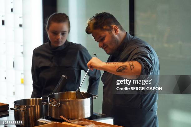 Chefs prepare food at the kitchen of the Alchemist restaurant in Copenhagen, Denmark, on May 25, 2023. With off-the-wall dishes like butterfly wings...