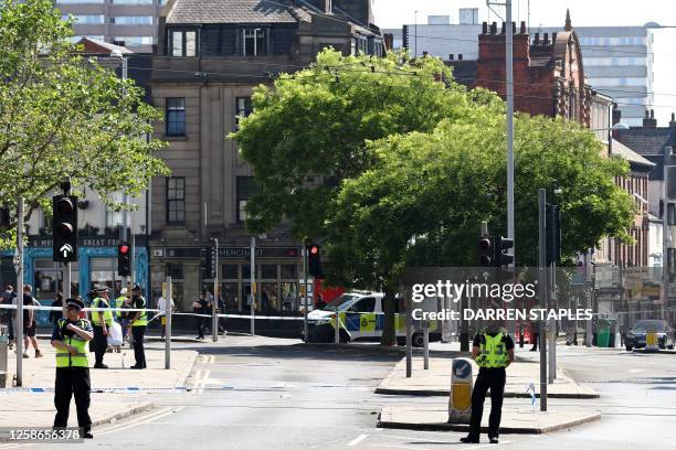 Police officer stands by a cordon outside the Theatre Royal on Upper Parliament Street in Nottingham, central England, during a 'major incident' in...