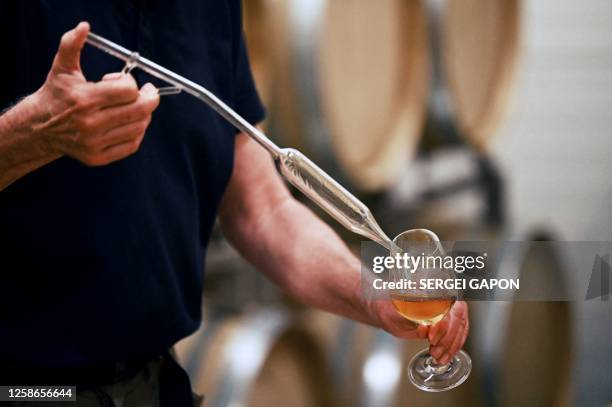 Niels Fink, owner of the Vejrhøj vineyard plantation, works on his wine production in a cellar at his house outside the small town of Fårevejle...