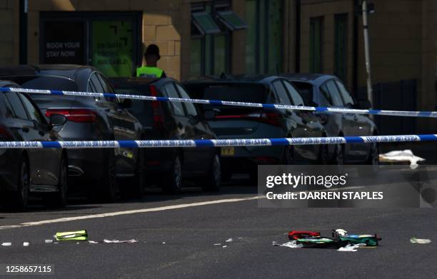 Medical equipment is pictured strewn across Ilkeston Road, inside a police cordon in Nottingham, central England, during a 'major incident' in which...