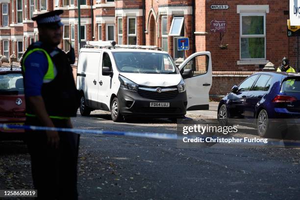 Police officers guard an area of Bentinck road near a van which is potentially connected with a major incident earlier today on June 13, 2023 in...