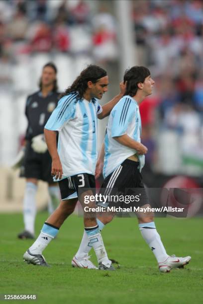August 17: Juan Pablo Sorin of Argentina consoles Lionel Messi of Argentina after he received a red card during the international friendly match...
