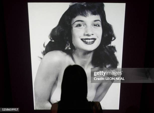 Girl looks at one of the slides in a presentation of images from the the Kinsey Institute, an organisation that promotes interdisciplinary research...