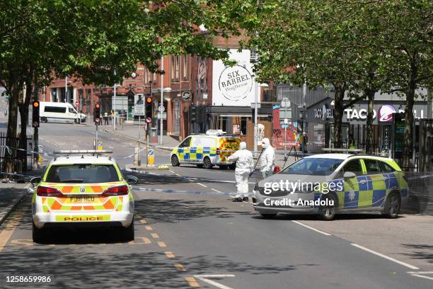 Police forensics are seen at the scene in Nottingham, United Kingdom on June 13, 2023. Three people have been found dead and a man has been arrested...