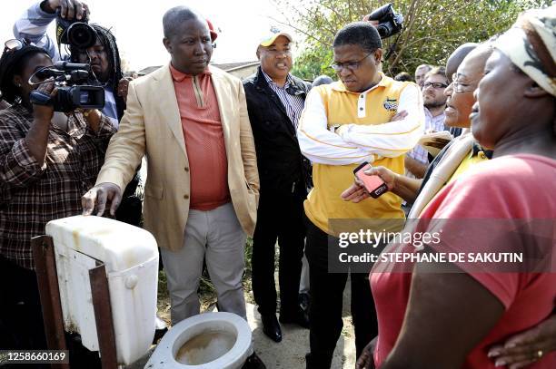 Julius Malema , President of the ANC youth league flanked by Fikile Mbalula , South African Minister of sport and ANC head of organising and...