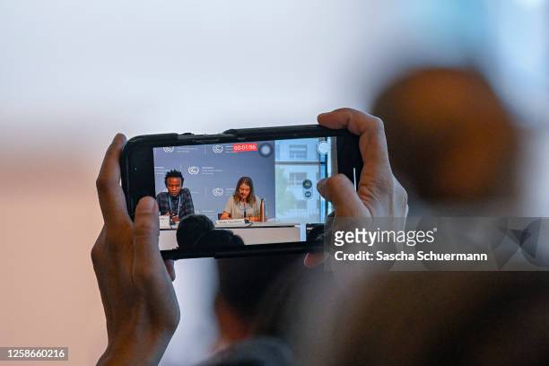 Climate justice organizer from Kenya, Eric Njuguna and Swedish climate activist Greta Thunberg are seen through a mobile camera as they take part in...