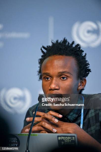Climate justice organizer from Kenya, Eric Njuguna, takes part in a press conference at the UNFCCC SB58 Bonn Climate Change Conference on June 13,...
