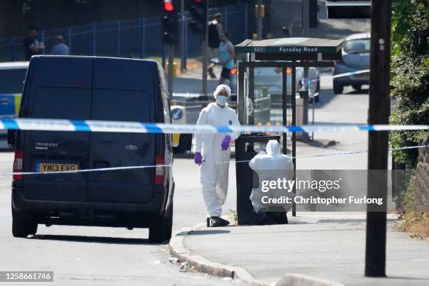 Forensic police investigate a bus top in Ilkeston road after several people were attacked earlier today on June 13, 2023 in Nottingham, England....