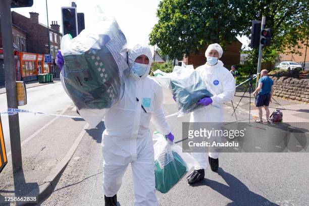 Police forensics inspect the scene in Nottingham city centre, United Kingdom on 13 June 2023. Three people have been found dead and a man has been...