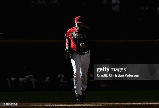 Relief pitcher J.J. Putz of the Arizona Diamondbacks runs out of the bullpen to pitch against the Pittsburgh Pirates during the ninth inning of the...