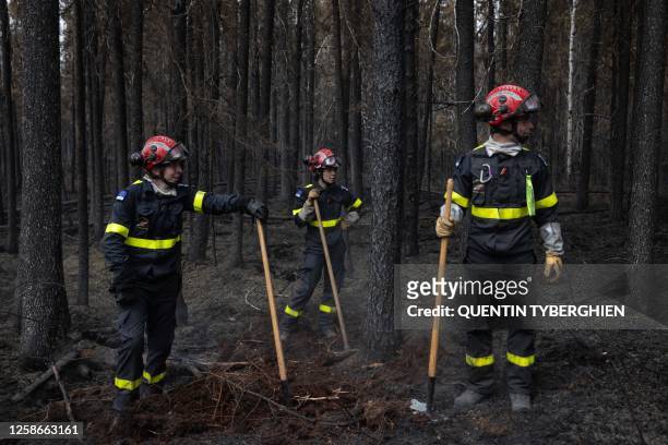 French firefighters look on as they battle fires north from the city of Chibugamau, Quebec, in Canada on June 12, 2023. Quebec has deployed hundreds...
